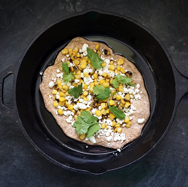 Elote pizza (Mexican street food charred corn pizza) from @bijouxandbits #mexicanfood #cincodemayo #elote