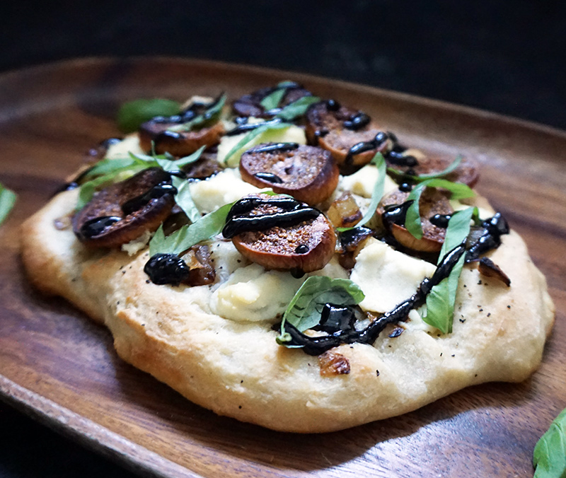 Caramelized onion, fig, and ricotta pizza from @bijouxandbits #pizza #ricotta