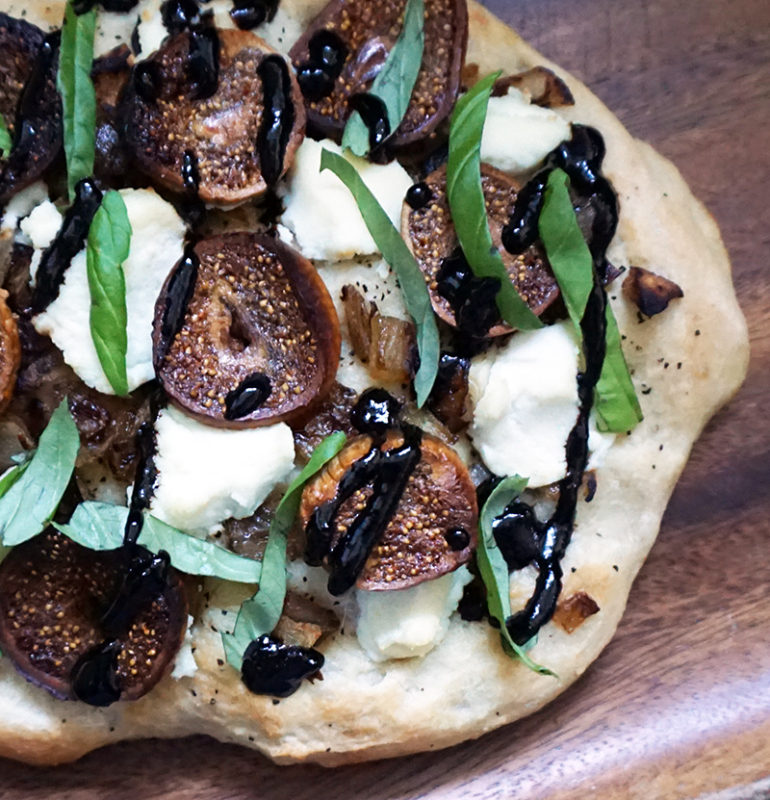 Caramelized onion, fig, and ricotta pizza from @bijouxandbits #pizza #ricotta